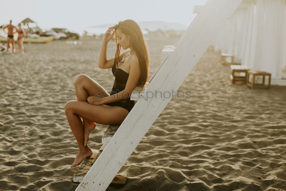 Similar – Image, Stock Photo Young woman with a swimming suit walking in a wooden foot bridge at the beach