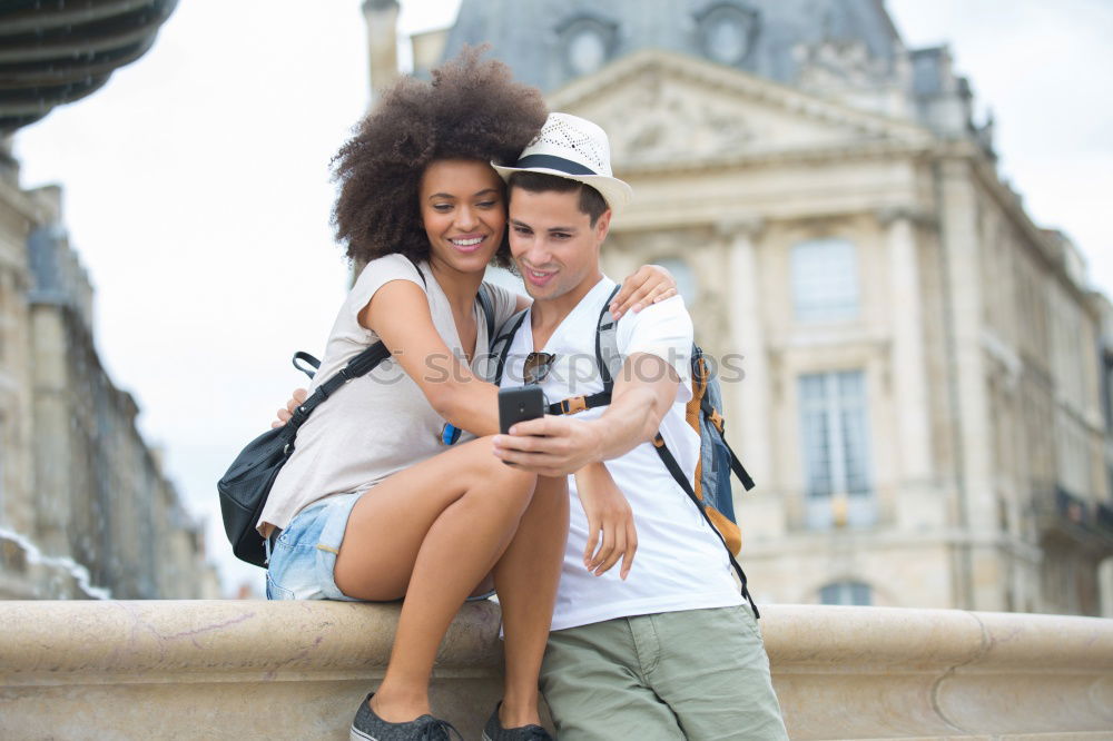 Similar – Happy loving couple. Happy young man piggybacking his girlfriend.