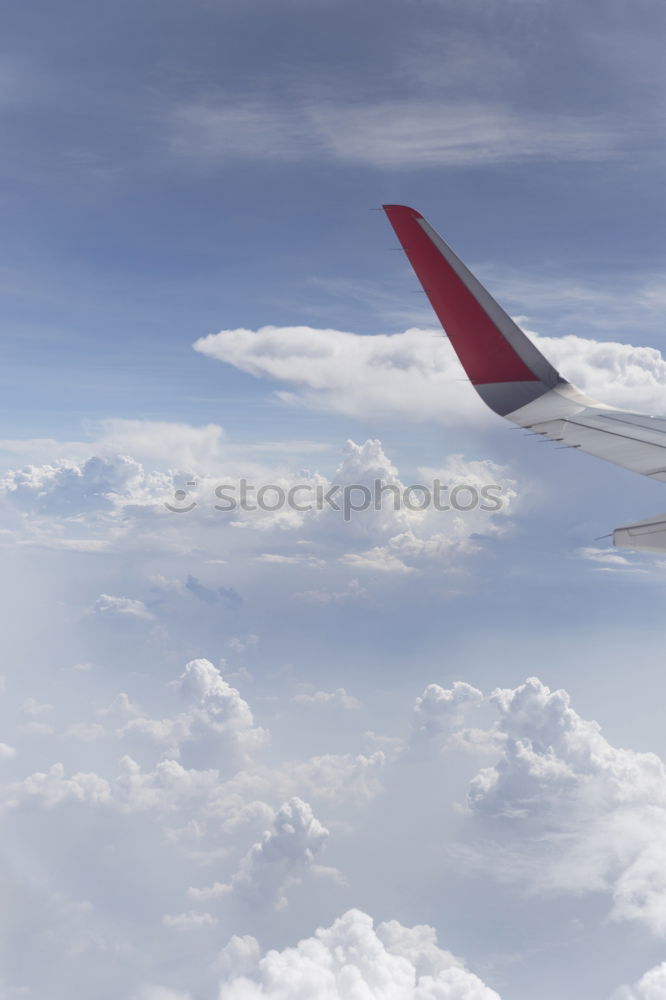 Similar – Foto Bild über den Wolken Flugzeug