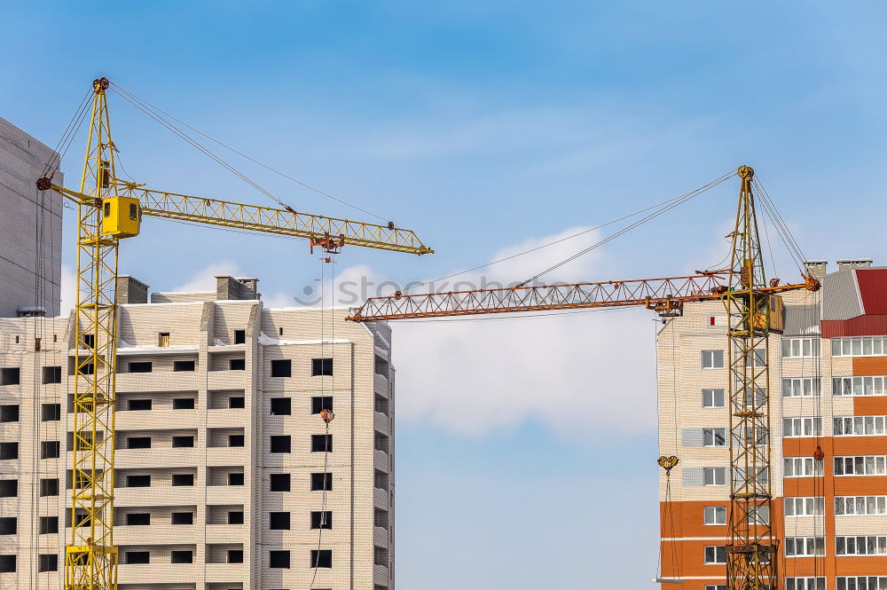 Similar – Construction site with building cranes