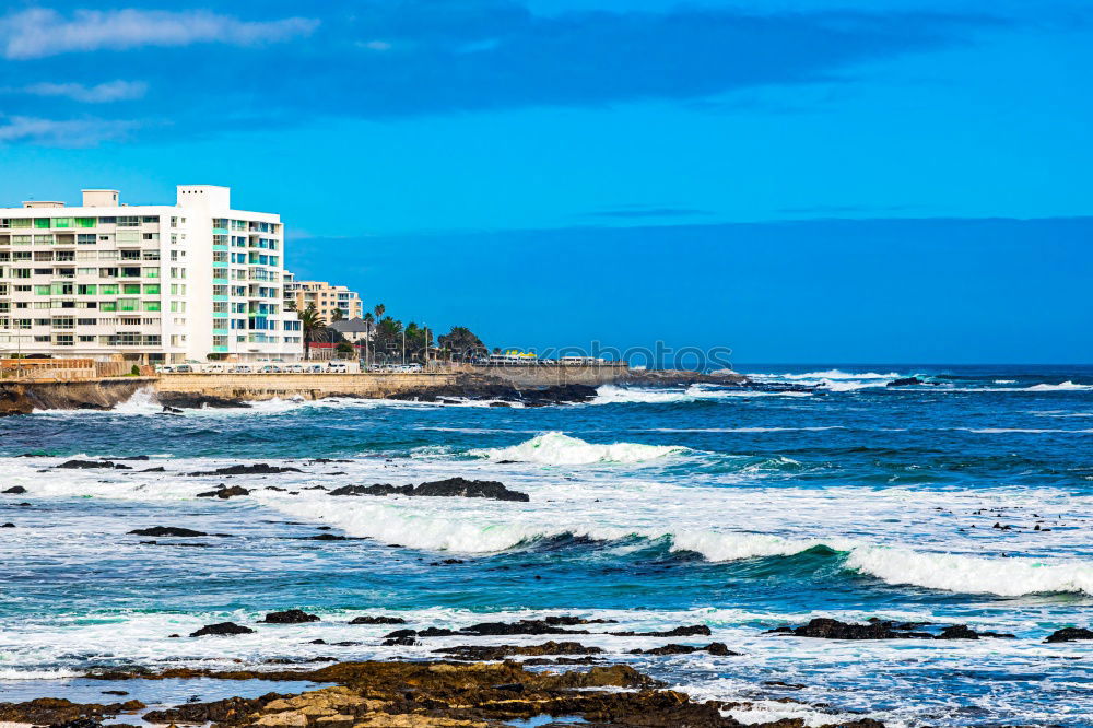 Similar – Scenic aerial view of city on ocean shore