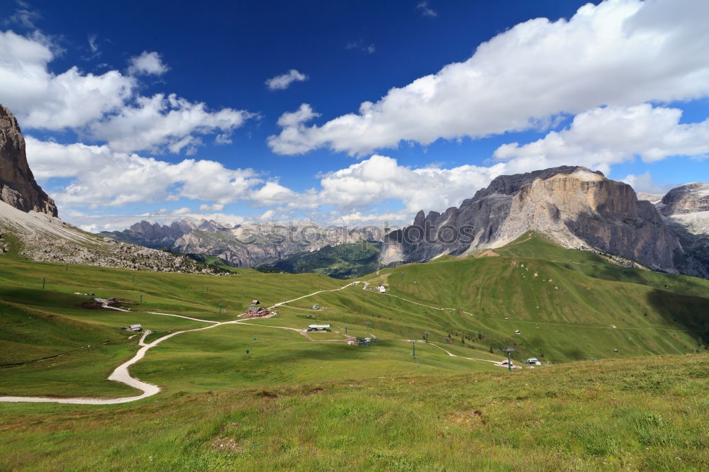 Similar – Image, Stock Photo Clouds and shadows in the Dolomites with path in portrait format