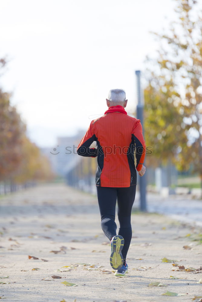 Similar – Image, Stock Photo Rear view of a senior man in sport clothes jogging in the park