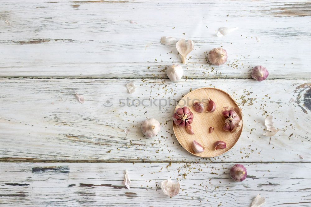 Similar – Image, Stock Photo Removing the grains of a head of garlic