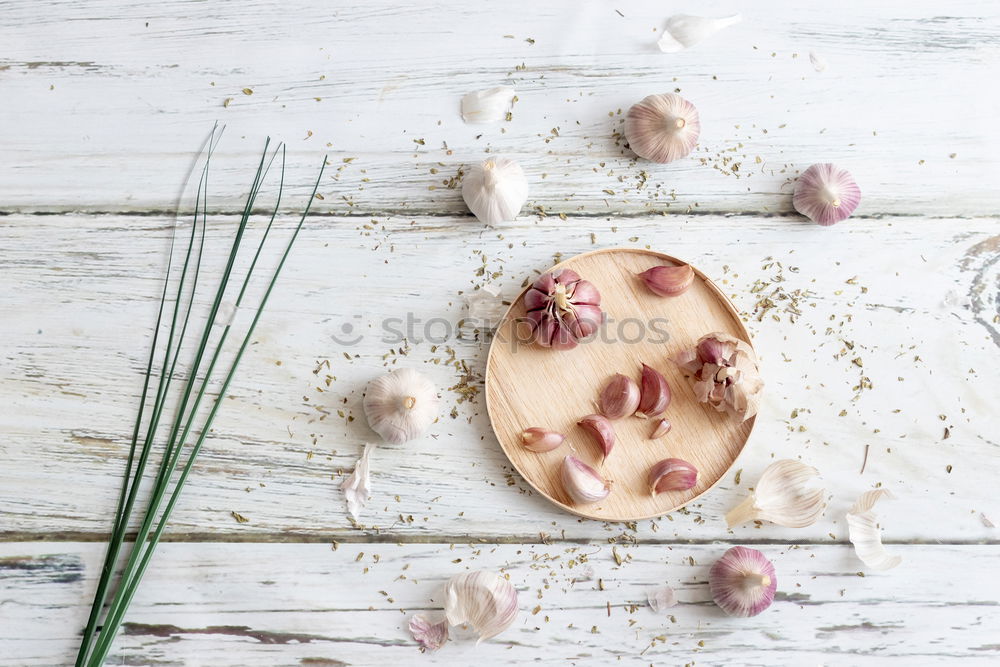 Similar – Image, Stock Photo Removing the grains of a head of garlic