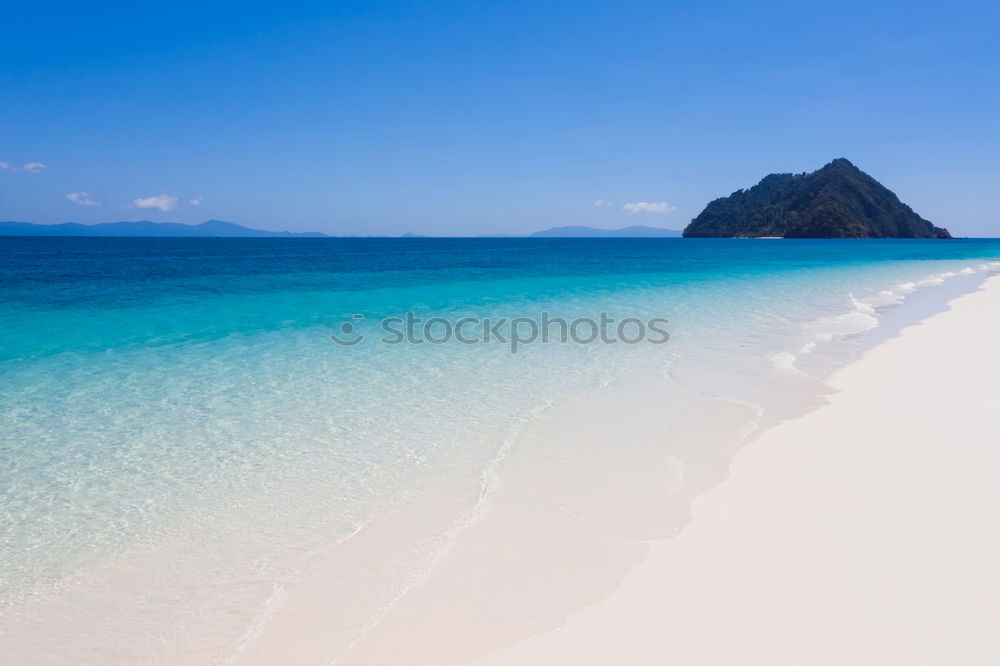 Similar – A view of a isolated beach and blue waters