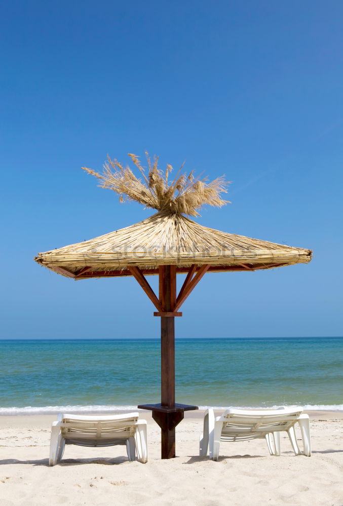 Similar – Empty deckchairs on the beach