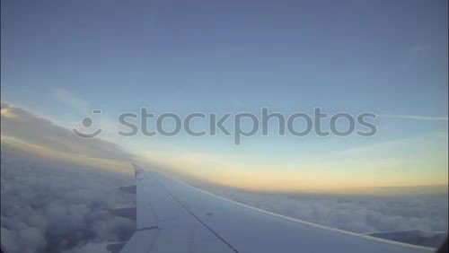 Similar – Foto Bild Über den Wolken Flugzeug