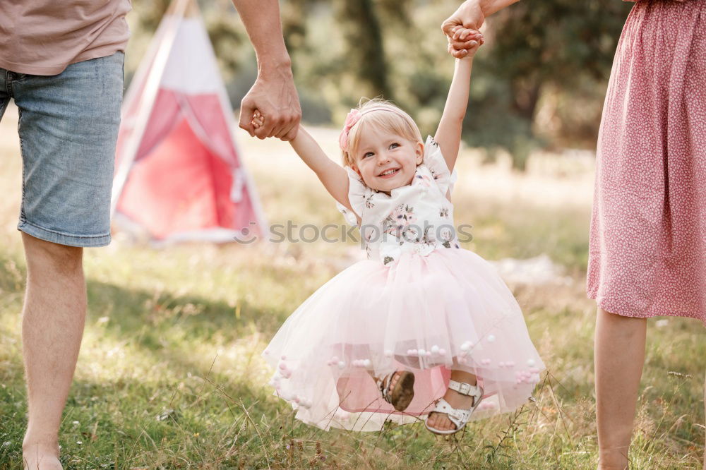 Similar – Baby girl holding finger of senior man hand