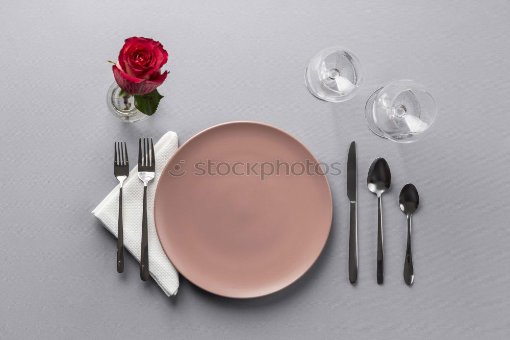 Similar – White plate with vintage iron cutlery