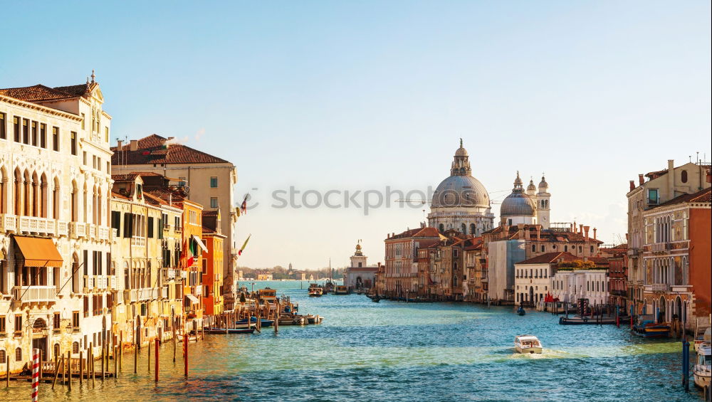 Urban landscape of Venice, water canals with boats.