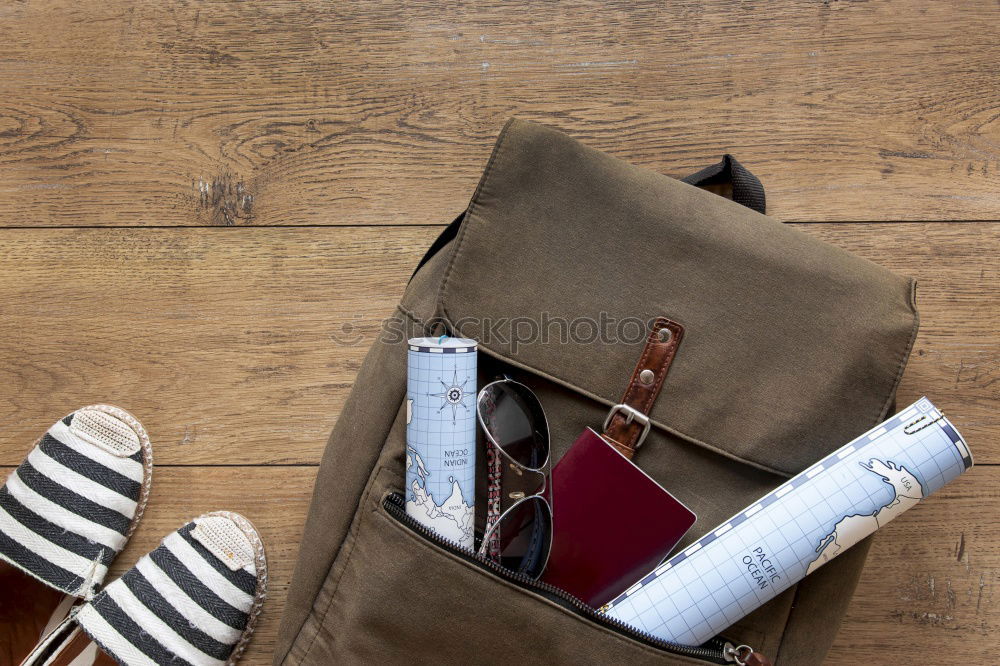 Notebooks pencils and school bag on a desktop