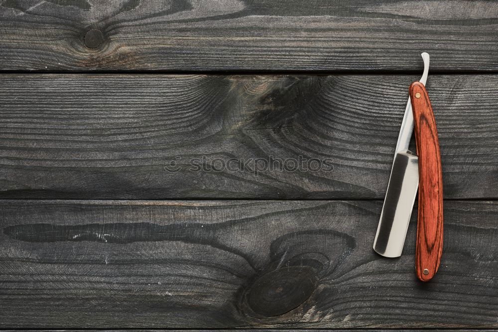 Similar – Brown wooden background with black frying pan