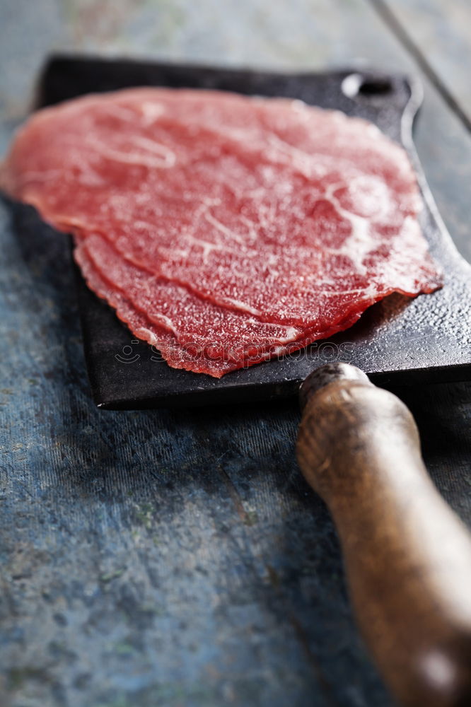 Image, Stock Photo Schnitzel meat on a rustic wooden table