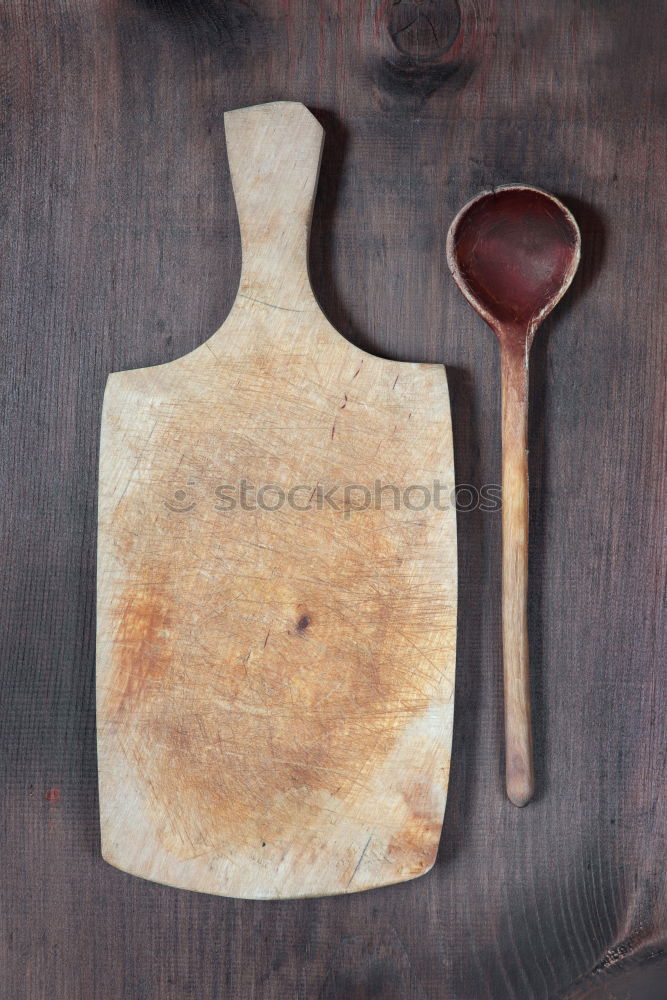 Similar – empty old brown wooden cutting board and spoon