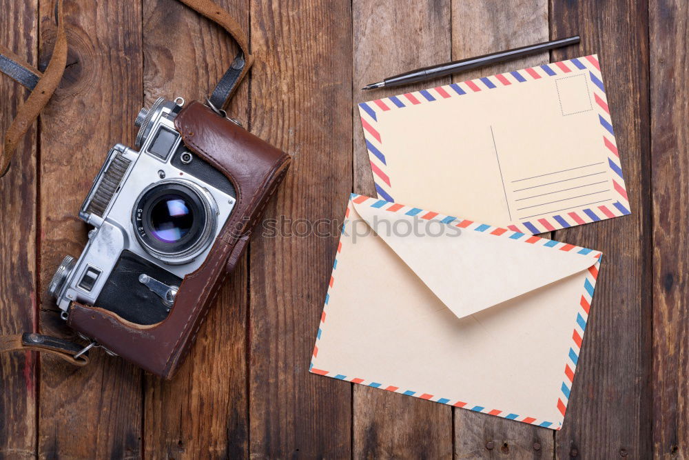 Similar – Camera, glasses and notepad on wood