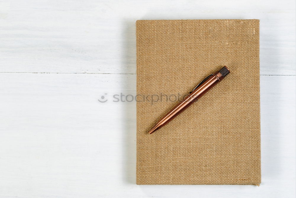 Similar – Foto Bild Ein offenes Notizbuch mit einem Stift aus recyceltem Papier auf braunem geschreddertem Karton Hintergrund.