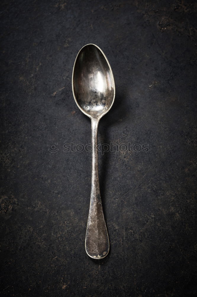 Similar – old metal fork and spoon tied with a brown rope