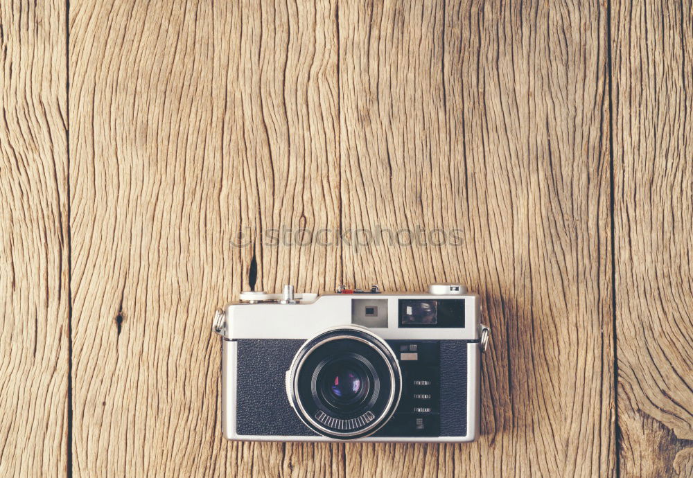 Similar – Camera, glasses and notepad on wood