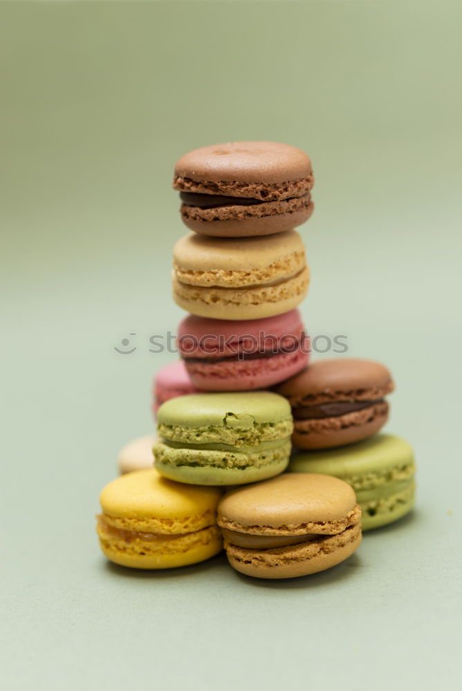 Front view of colorful macaroons on a marble background