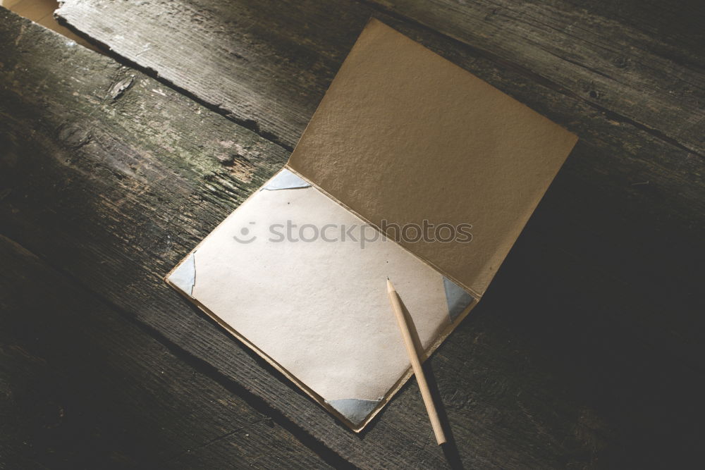 Green office: notepad with pencil, eraser, sharpener, hole punch and a cup of coffee