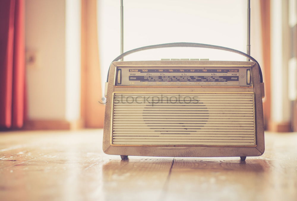 Similar – retro styled young woman poses with radio in front of old wooden gate. Music notes. tube radio