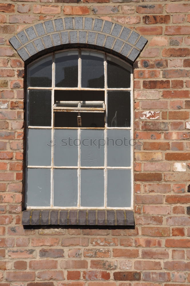 Similar – Two windows of a warehouse with red clinker and closed windows