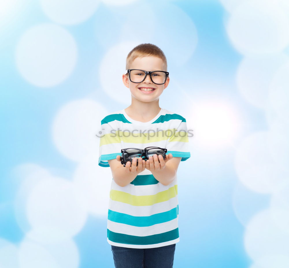 Similar – smiling baby with an orange on blue background