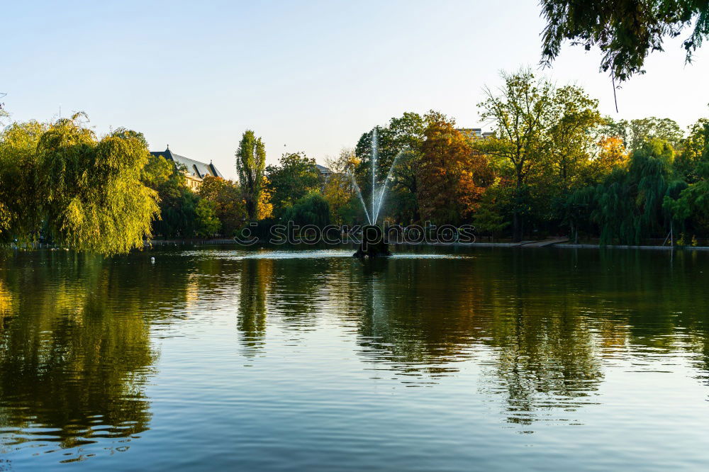 Similar – Tranquil, calm Rhine river scene with arched bridge