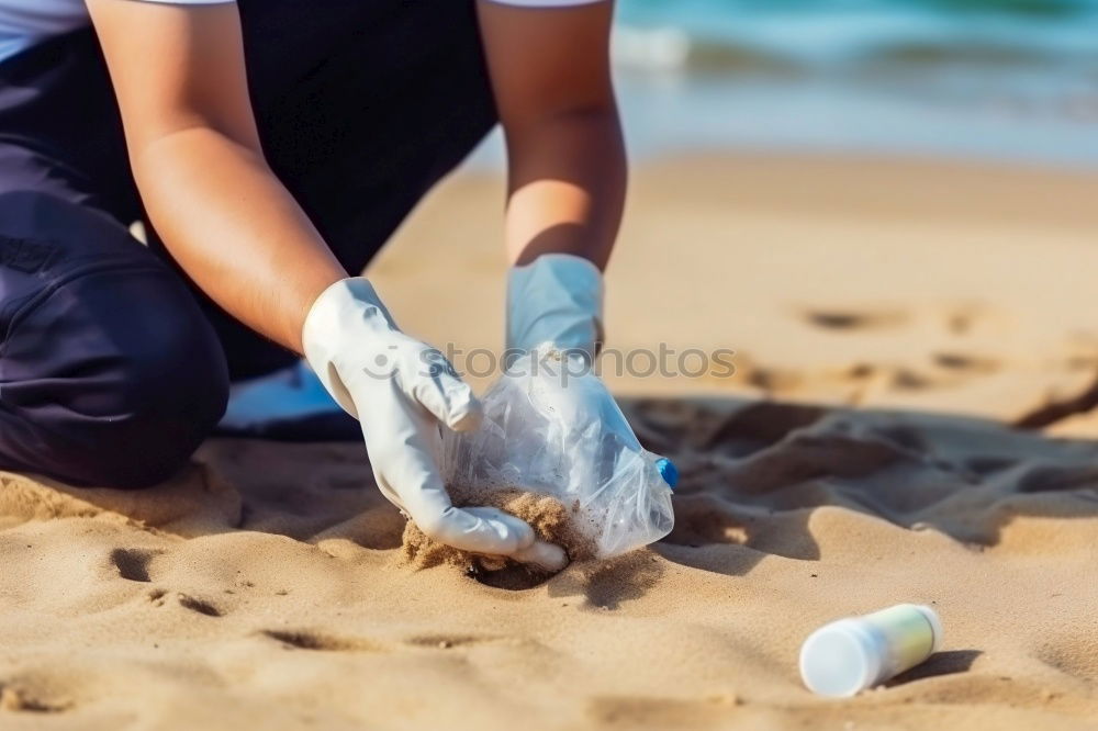 Similar – Child makes sand cake with bucket shape