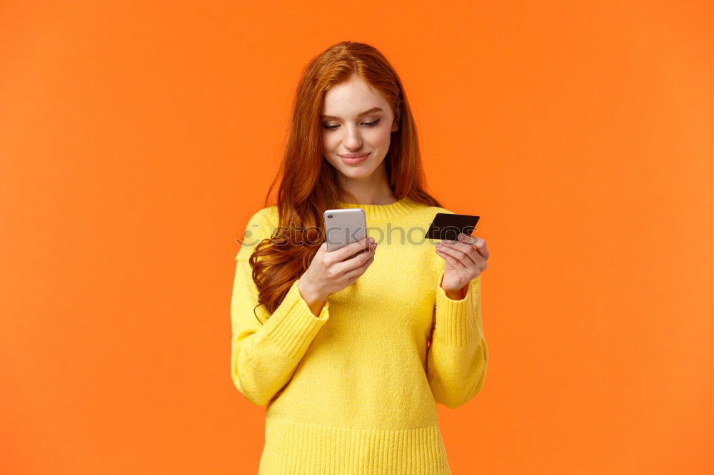 Similar – Portrait of beautiful young woman using mobile phone in the street.