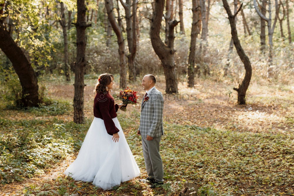 Similar – Elferly fit happy couple hiking through forest together on vacation