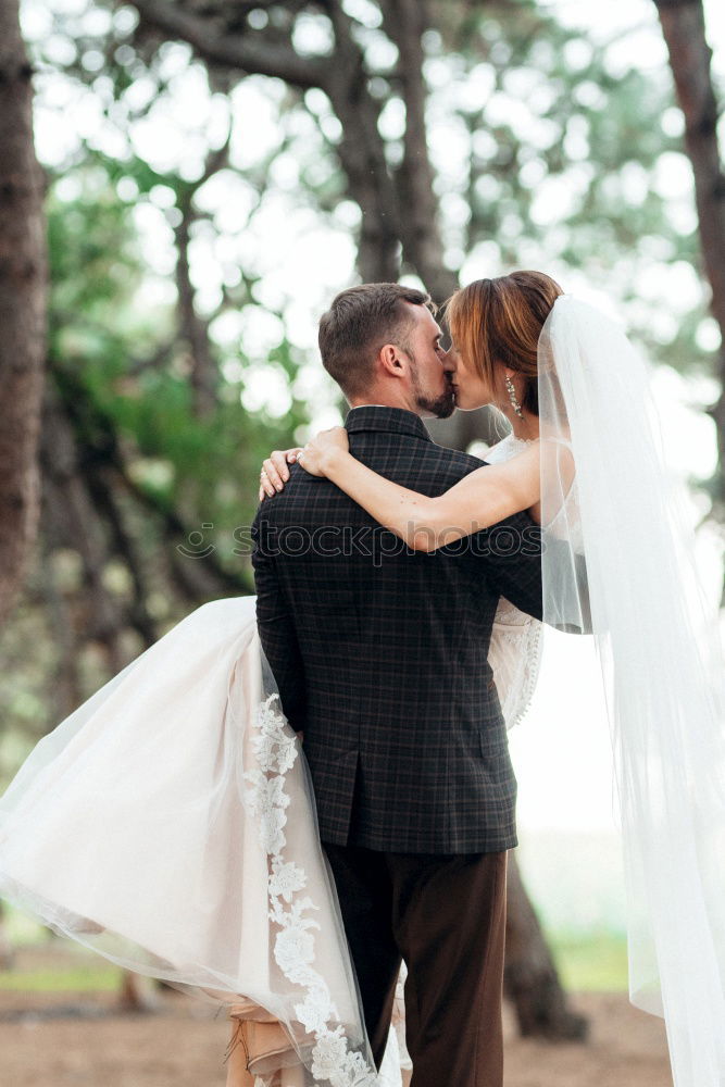 Similar – Image, Stock Photo Sensual wedding couple kissing on shoreline
