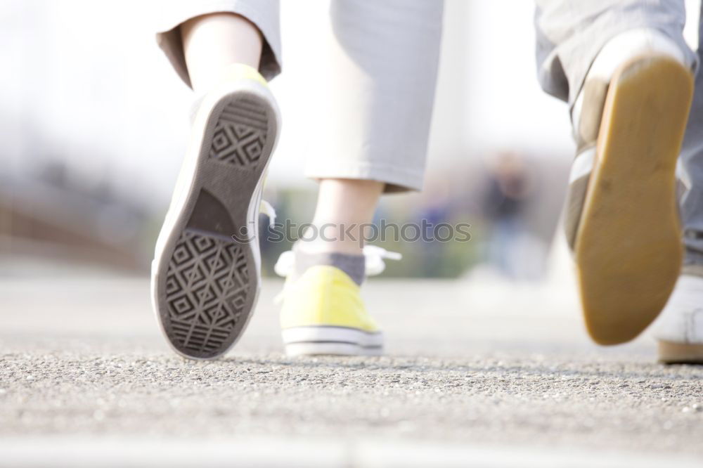 Similar – Image, Stock Photo Close-up shot of man tying running shoes with foot on the bench. Getting ready before jogging. Going in for sports, healthy lifestyle