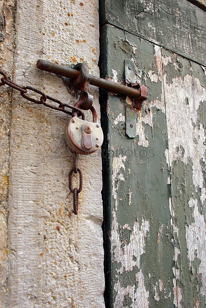 Similar – rusty garden gate closed with chain, with blurred background