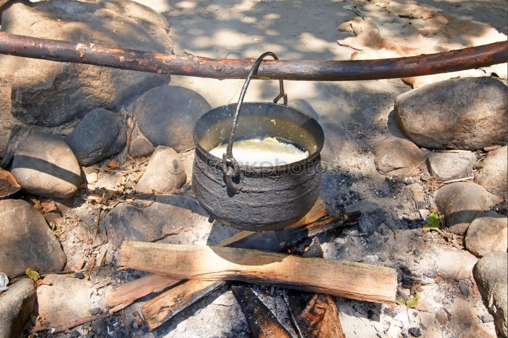 Similar – Blacksmith forges iron on anvil