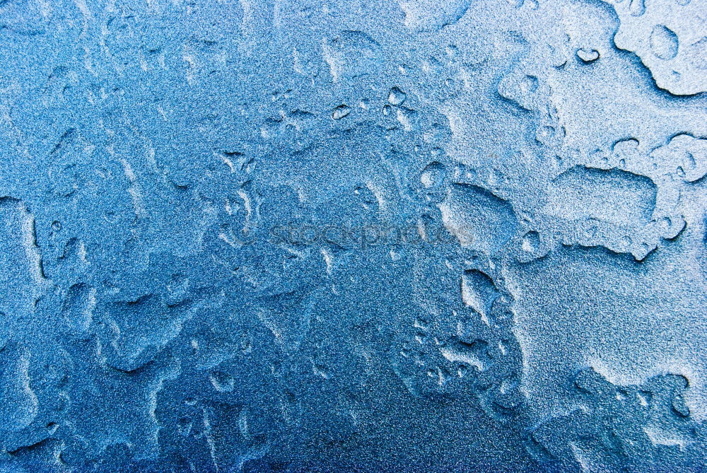 Similar – Rainwater on a blue garden table with reflection