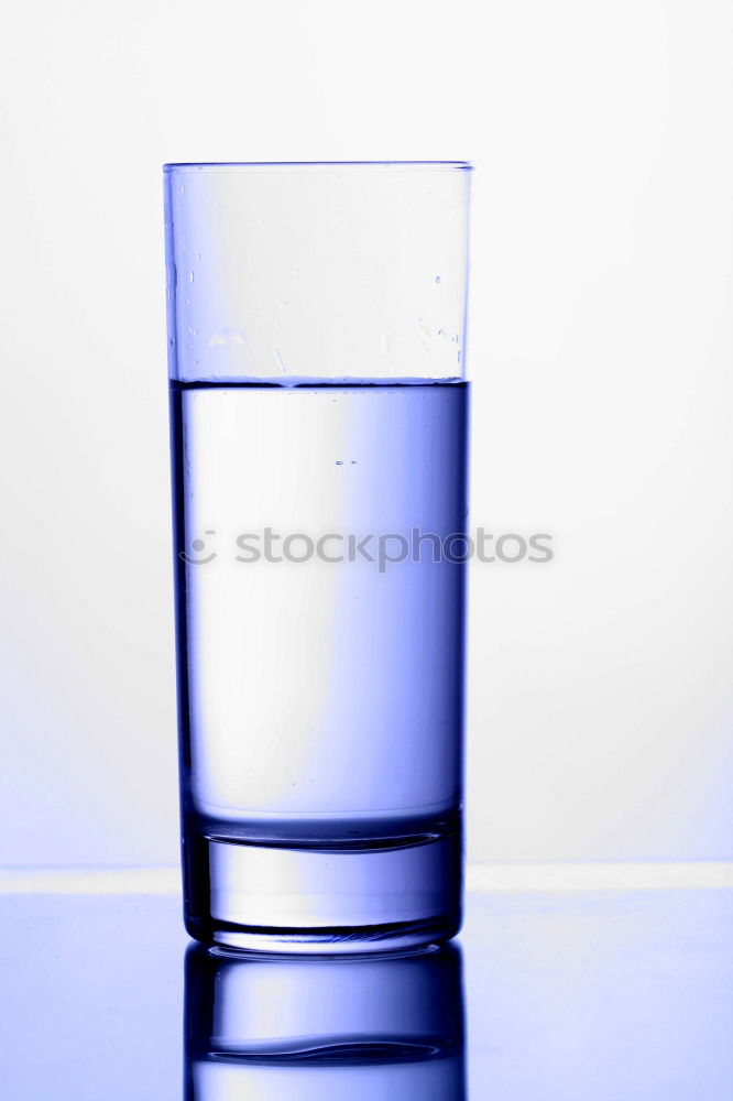 Similar – Water glass half full or half empty