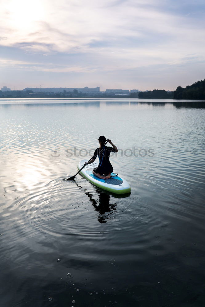 Unrecognizable traveler resting on kayak