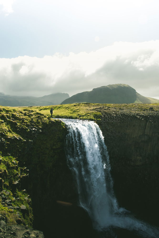 Similar – Backpacker jumping on landscape