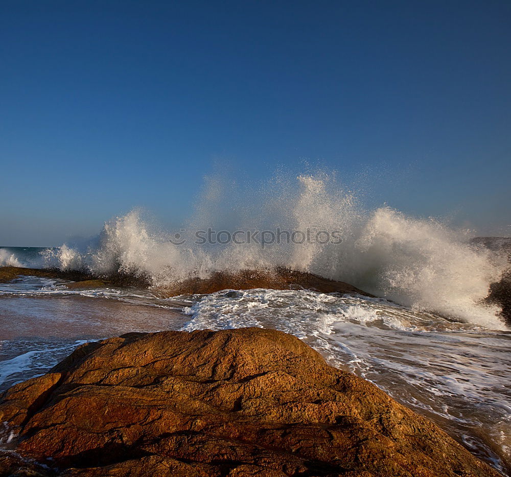 Similar – Rocks with spray in sunset in Portugal