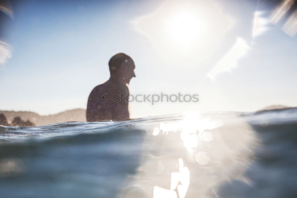 Similar – A young boy learning in body board outdoors in the shoreline in a sunny day of summer