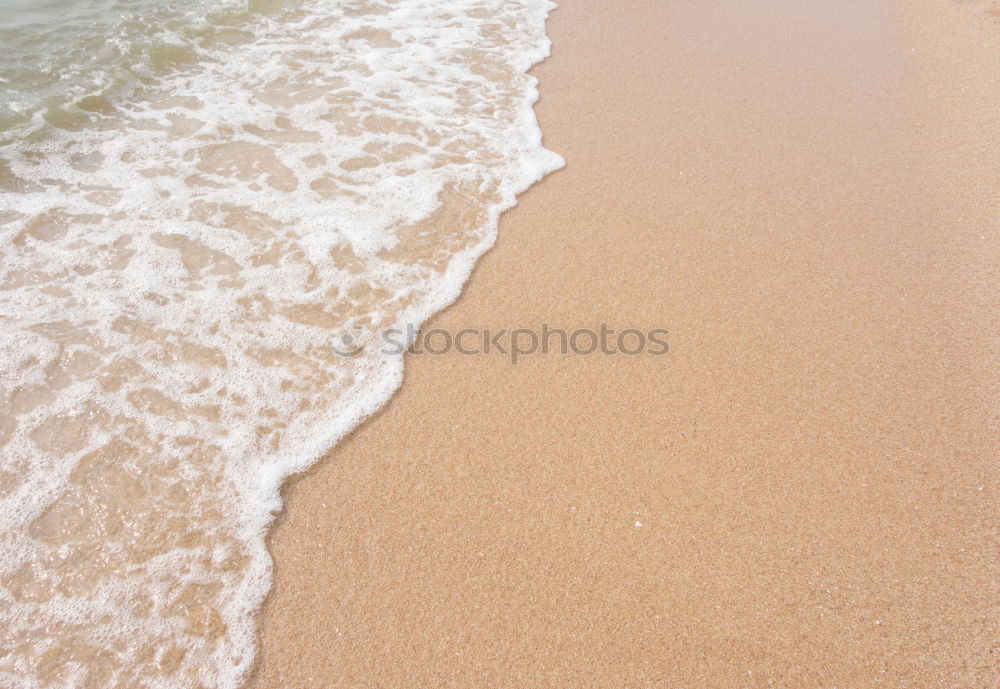 Similar – Foaming water of the Atlantic Ocean at a sandy beach