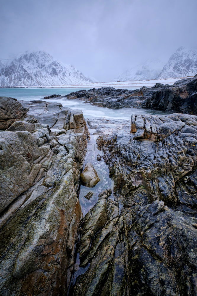 Similar – Eva Ozkoidi_Dusk on the beach of black stones, Lofoten