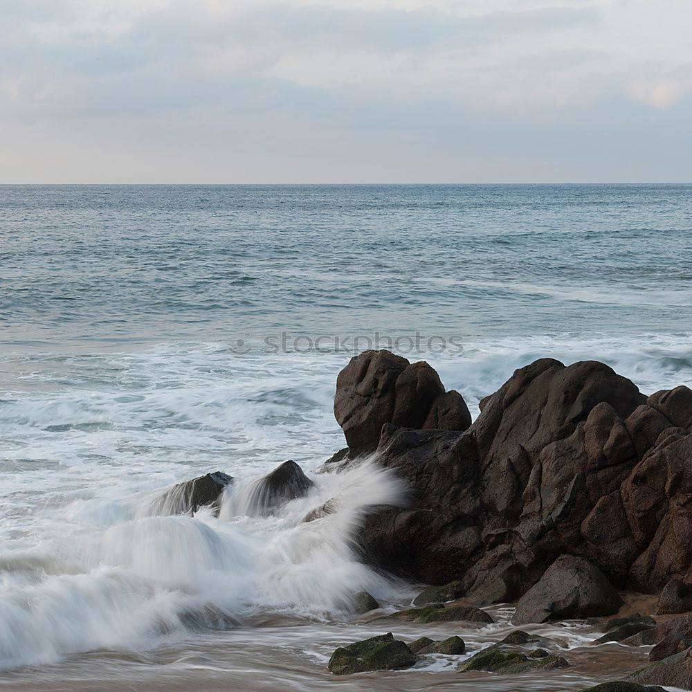 Similar – Rocks with spray in sunset in Portugal