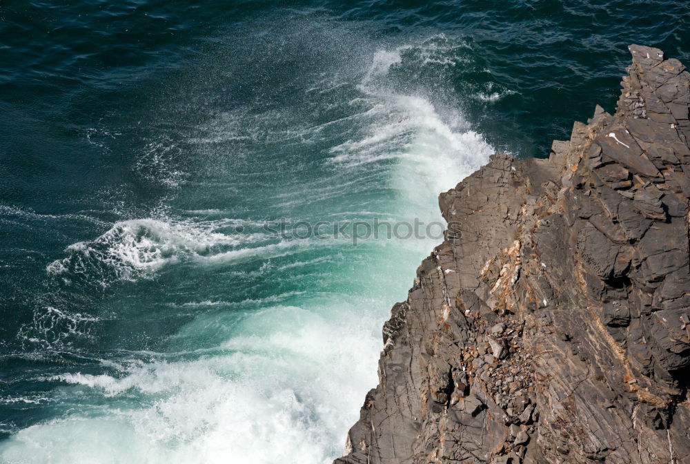 Similar – Aerial views of a coastline with waves and rocks