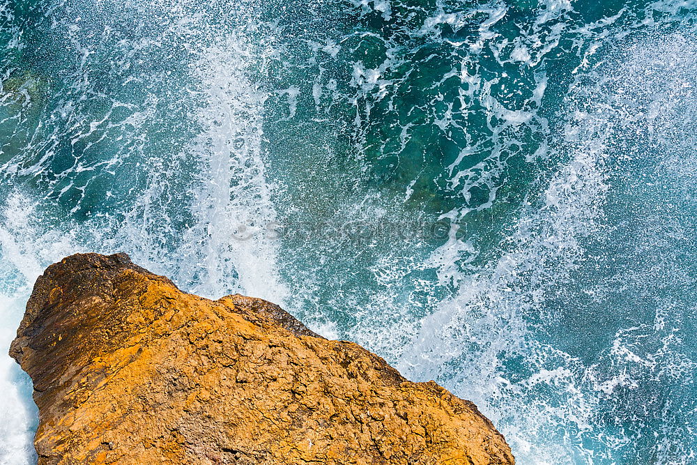 Similar – Aerial views of a coastline with waves and rocks