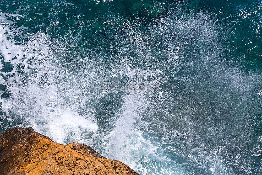 Similar – Aerial views of a coastline with waves and rocks