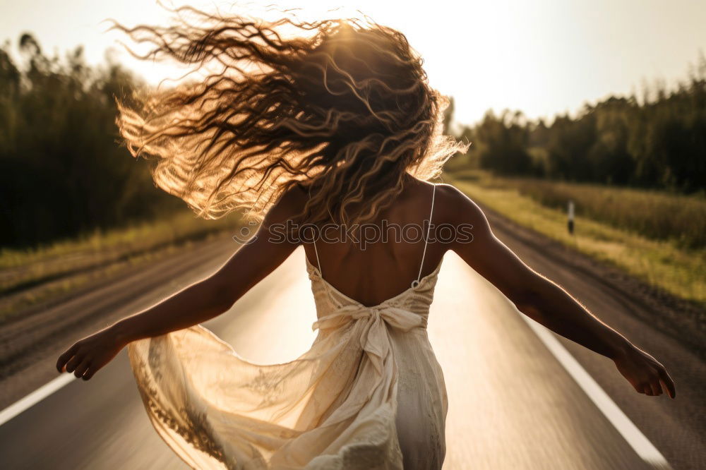 Similar – Young woman jogging down an autumn street