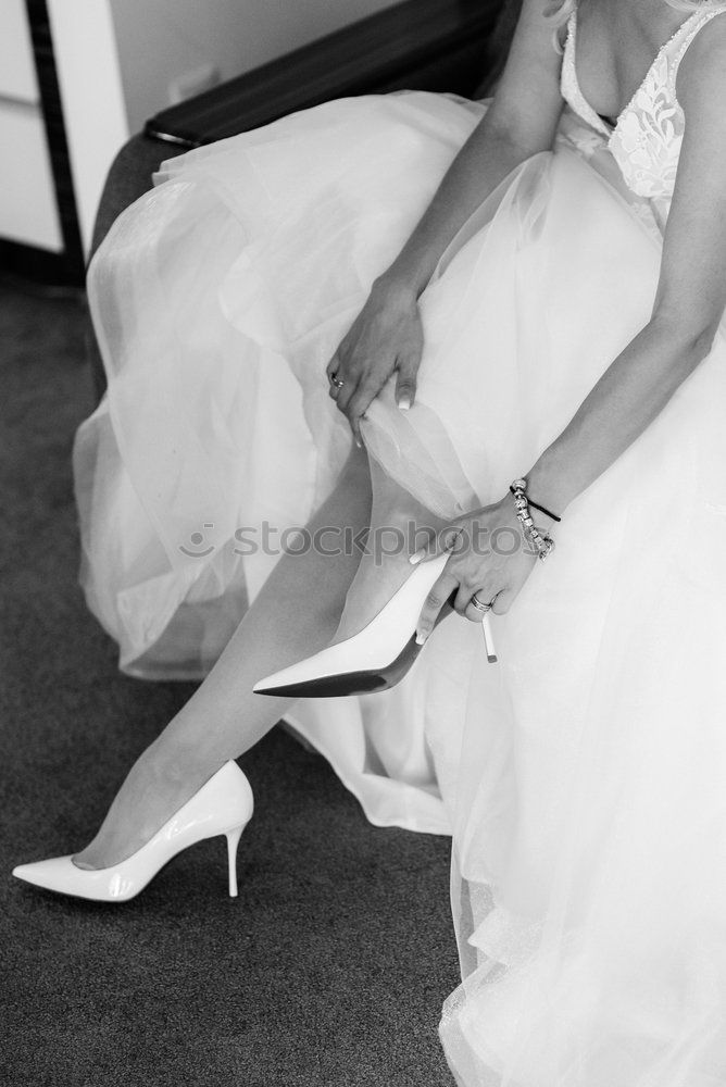 Similar – Image, Stock Photo Crop bride putting on shoes